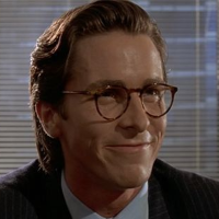 Patrick Bateman, a character from American Psycho. Played by Christian Bale. White guy in a suit with hair peeled back and very 1970's glasses.